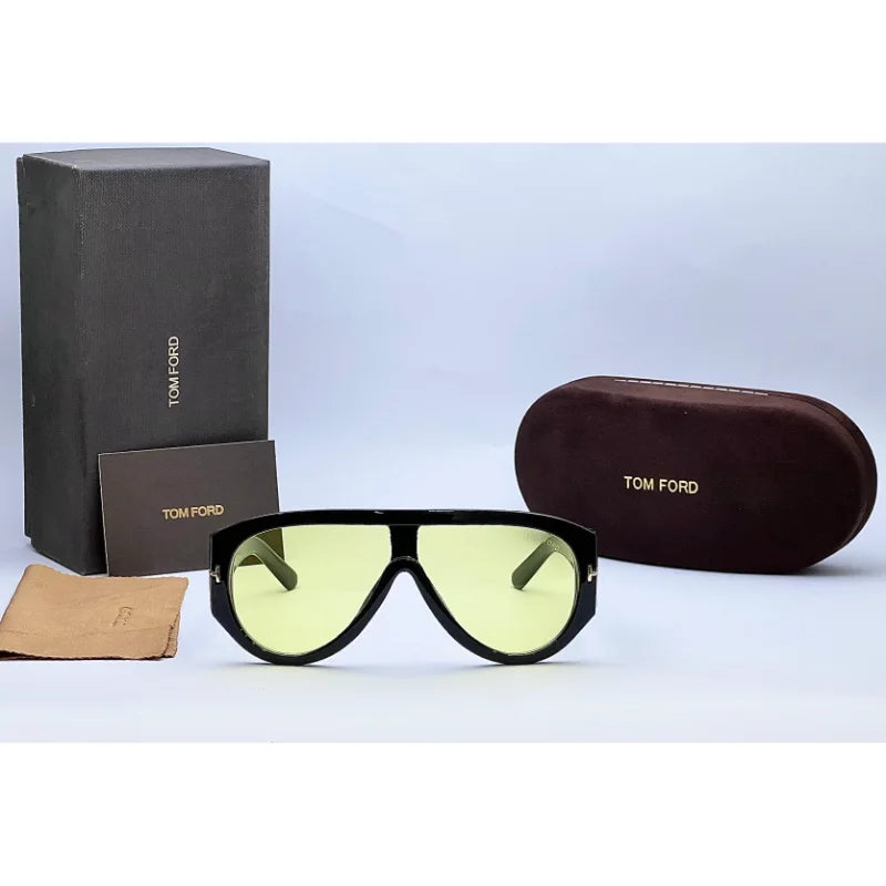 Tom Ford designer sunglasses placed on with tom ford brand box, Bronson model with light tinted lenses