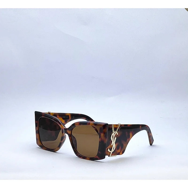 Close-up of Saint Laurent Blaze brown sunglasses side angle with YSL Paris logo on temple